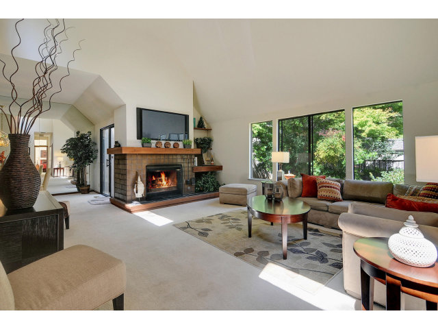 13 Farm Road Los Altos, CA 94024 - Photo 2 of 10 a living room with furniture fireplace and a large window
