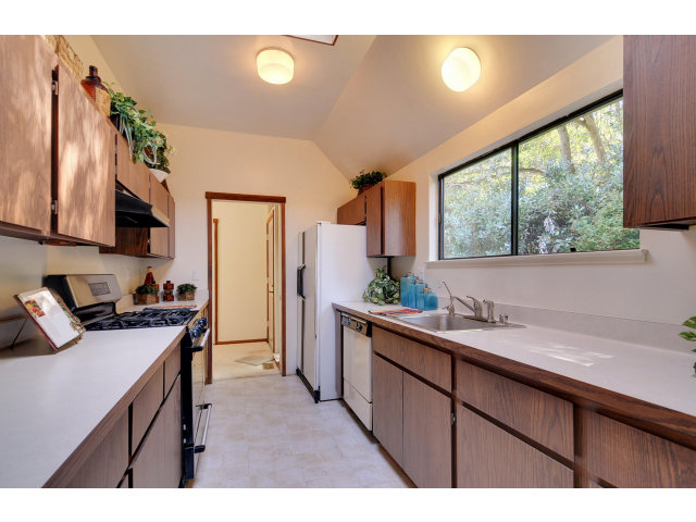 13 Farm Road Los Altos, CA 94024 - Photo 3 of 10 a kitchen with a sink stove and cabinets