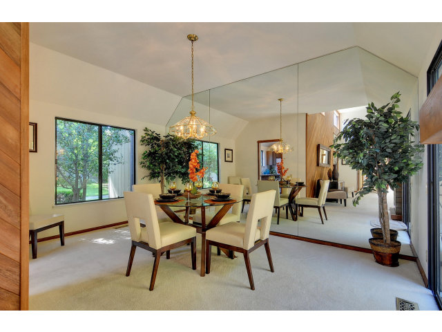 13 Farm Road Los Altos, CA 94024 - Photo 7 of 10 a view of a dining room and livingroom with furniture wooden floor a chandelier