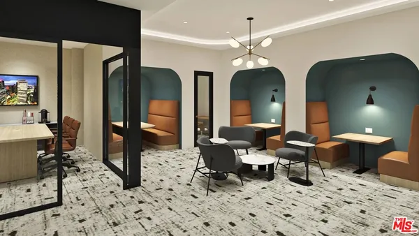 a living room with furniture a chandelier and a fireplace