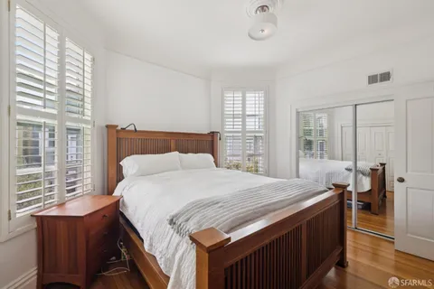 a bedroom with a bed and a table in it