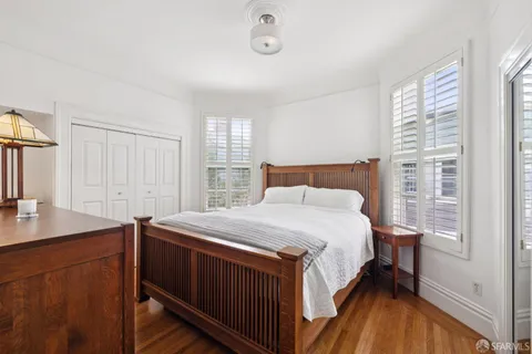 a view of a workspace with furniture and a bookshelf