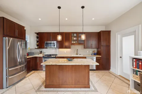 a bathroom with a granite countertop sink a mirror and a