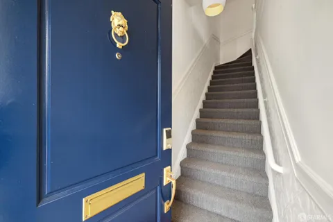 a view of a hallway with a chandelier
