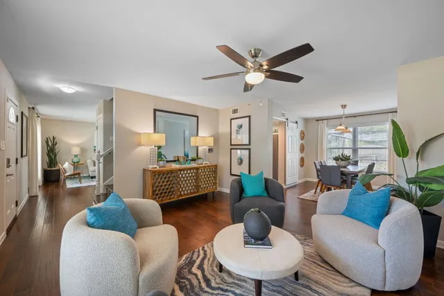 a view of entryway and hall with wooden floor