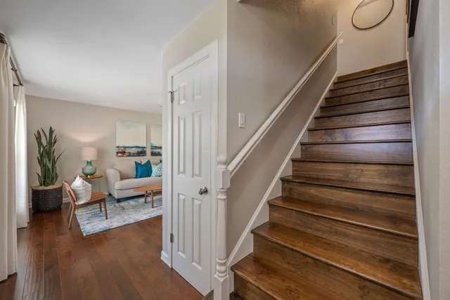 a view of entryway and hall with wooden floor