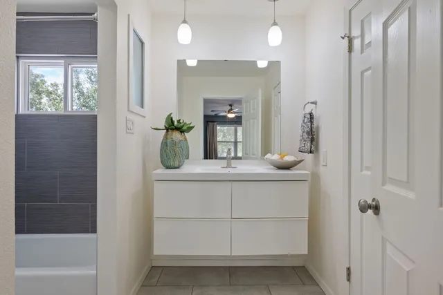 a bathroom with a bathtub and window