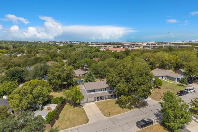 an aerial view of a house with a garden