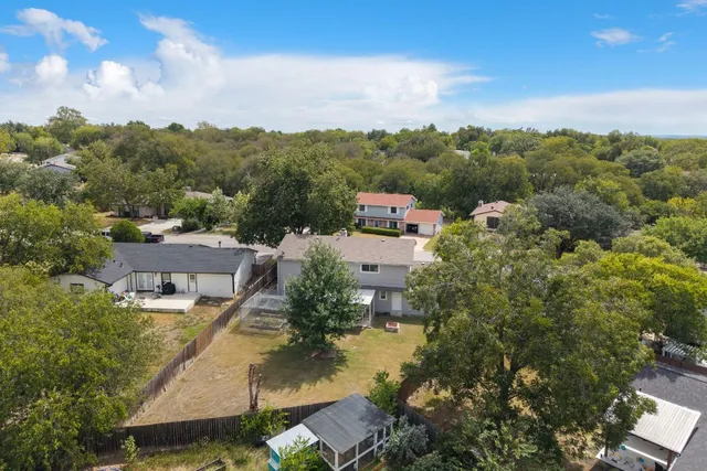 an aerial view of residential house with outdoor space