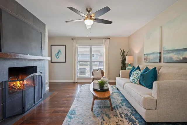 a living room with furniture and a fireplace
