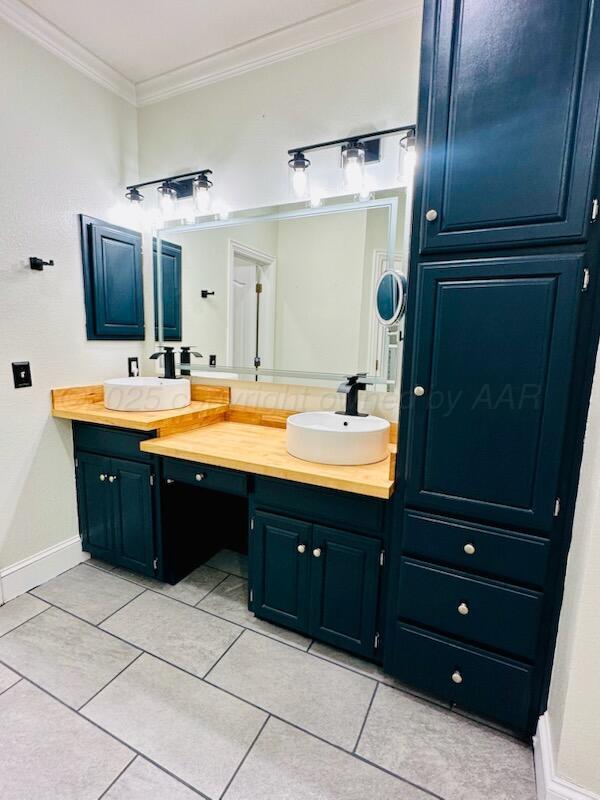 8211 Challenge Drive Amarillo, TX 79119 - Photo 18 of 31 a bathroom with a sink double vanity and a mirror