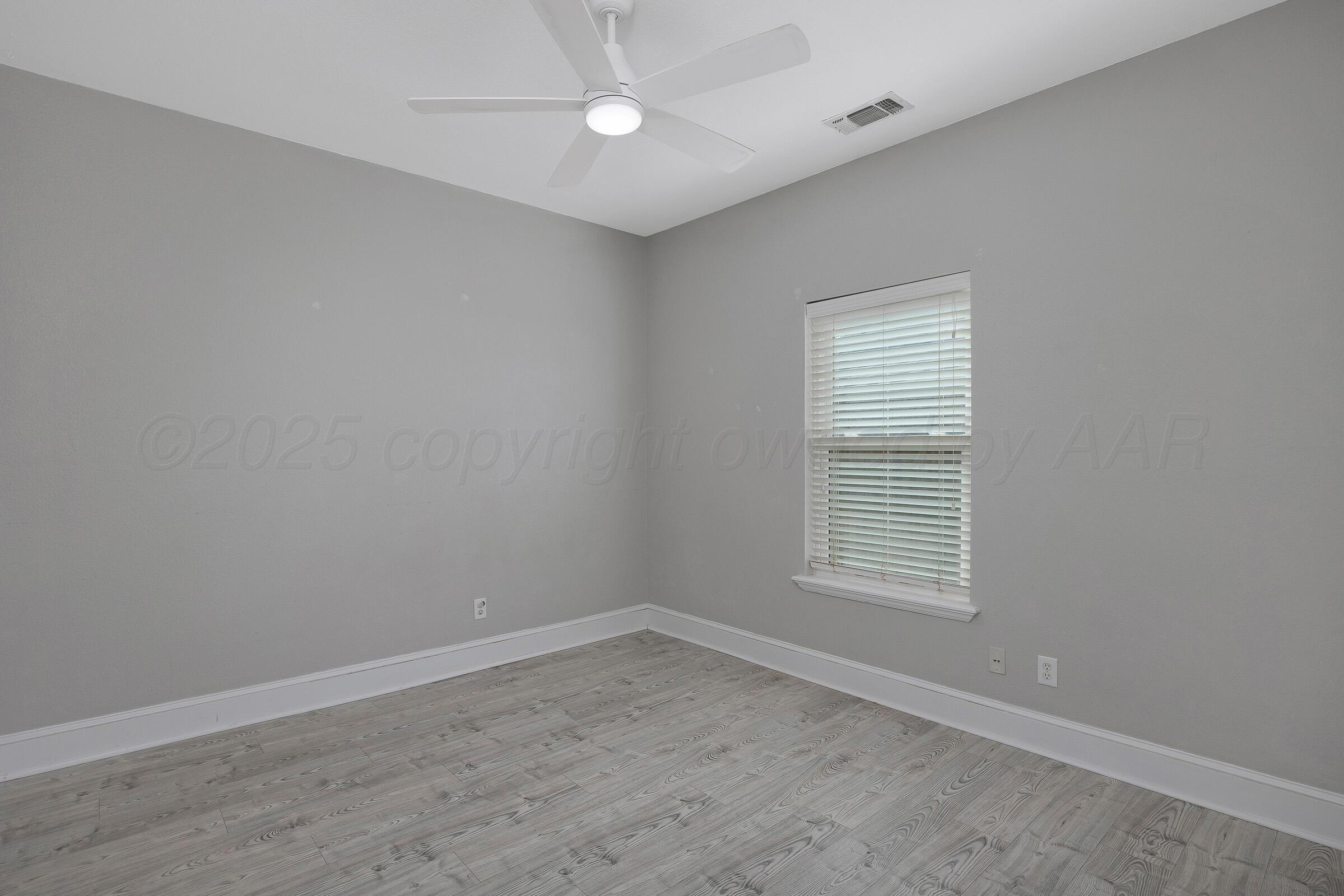 8211 Challenge Drive Amarillo, TX 79119 - Photo 22 of 31 an empty room with a window