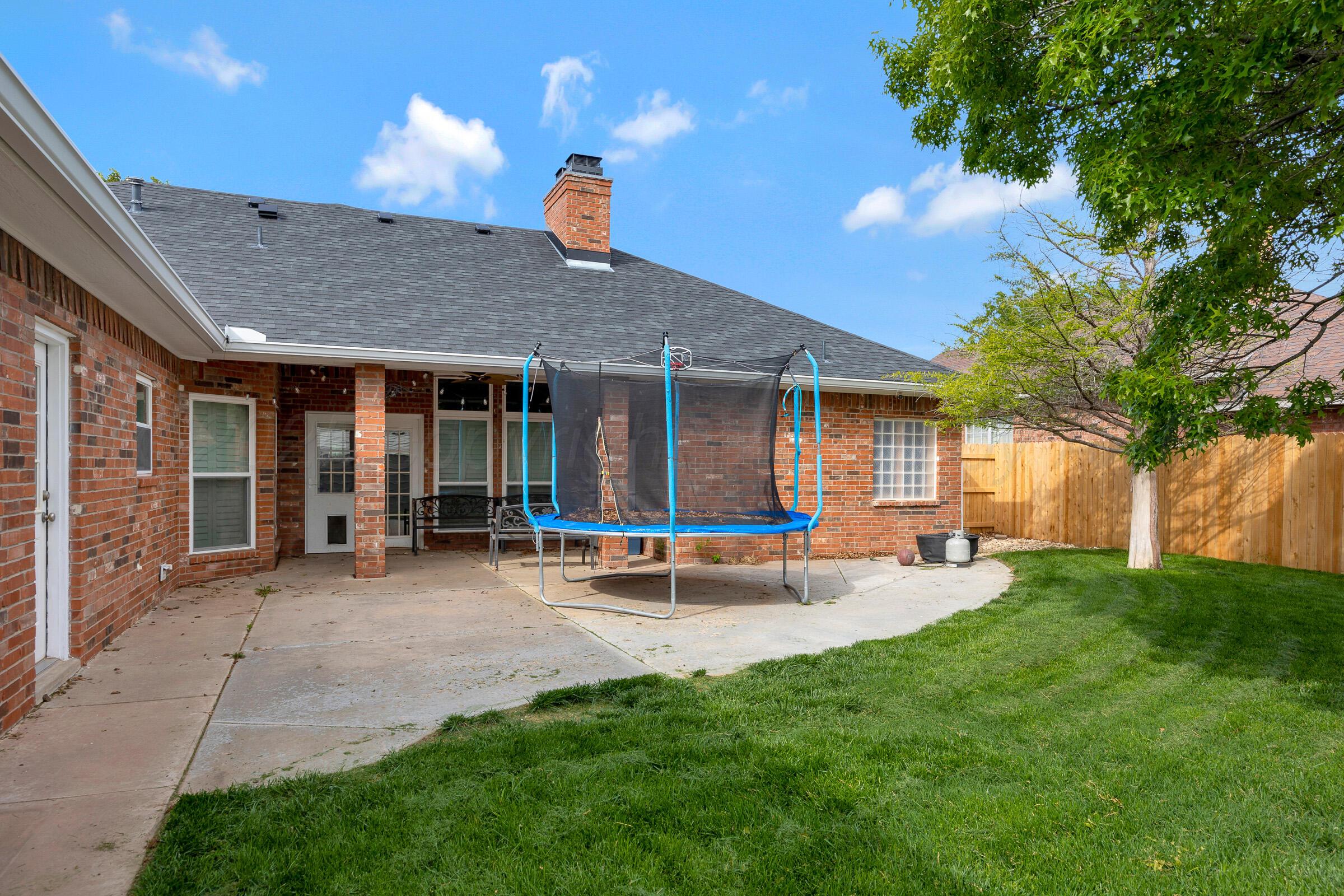 8211 Challenge Drive Amarillo, TX 79119 - Photo 26 of 31 a view of a house with a yard and sitting area