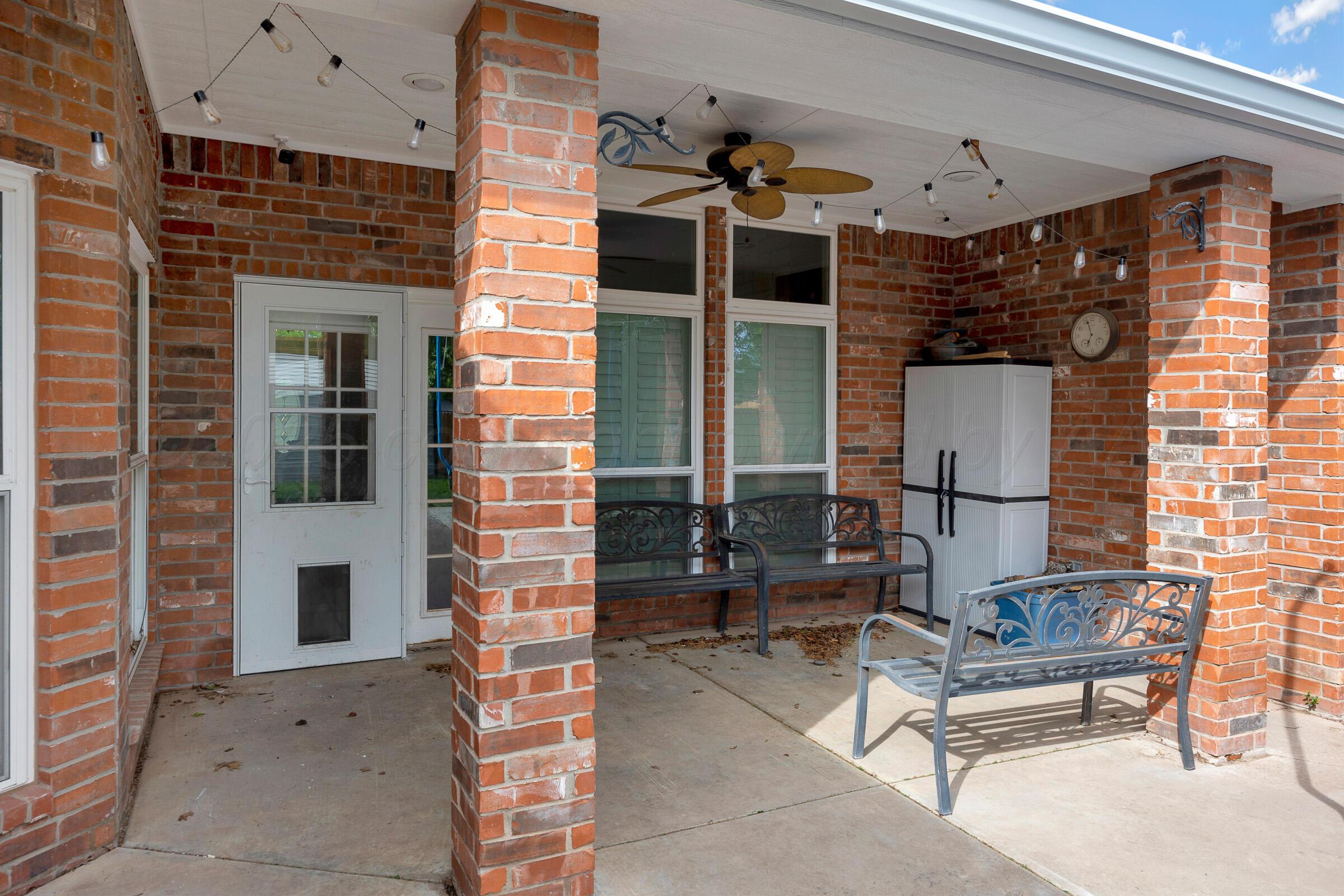 8211 Challenge Drive Amarillo, TX 79119 - Photo 27 of 31 a bench is sitting in front of a building