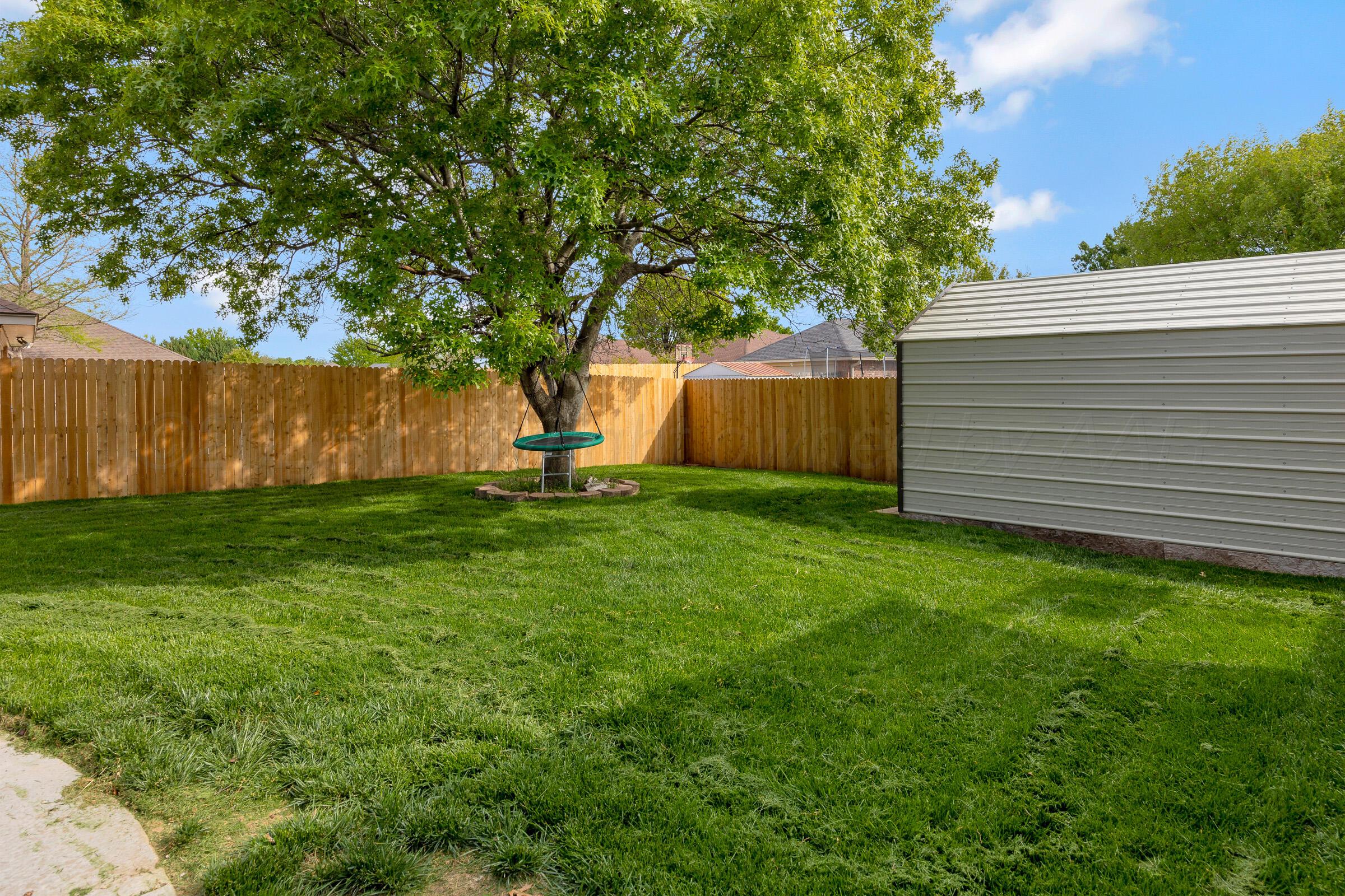 8211 Challenge Drive Amarillo, TX 79119 - Photo 28 of 31 a view of a backyard with a garden