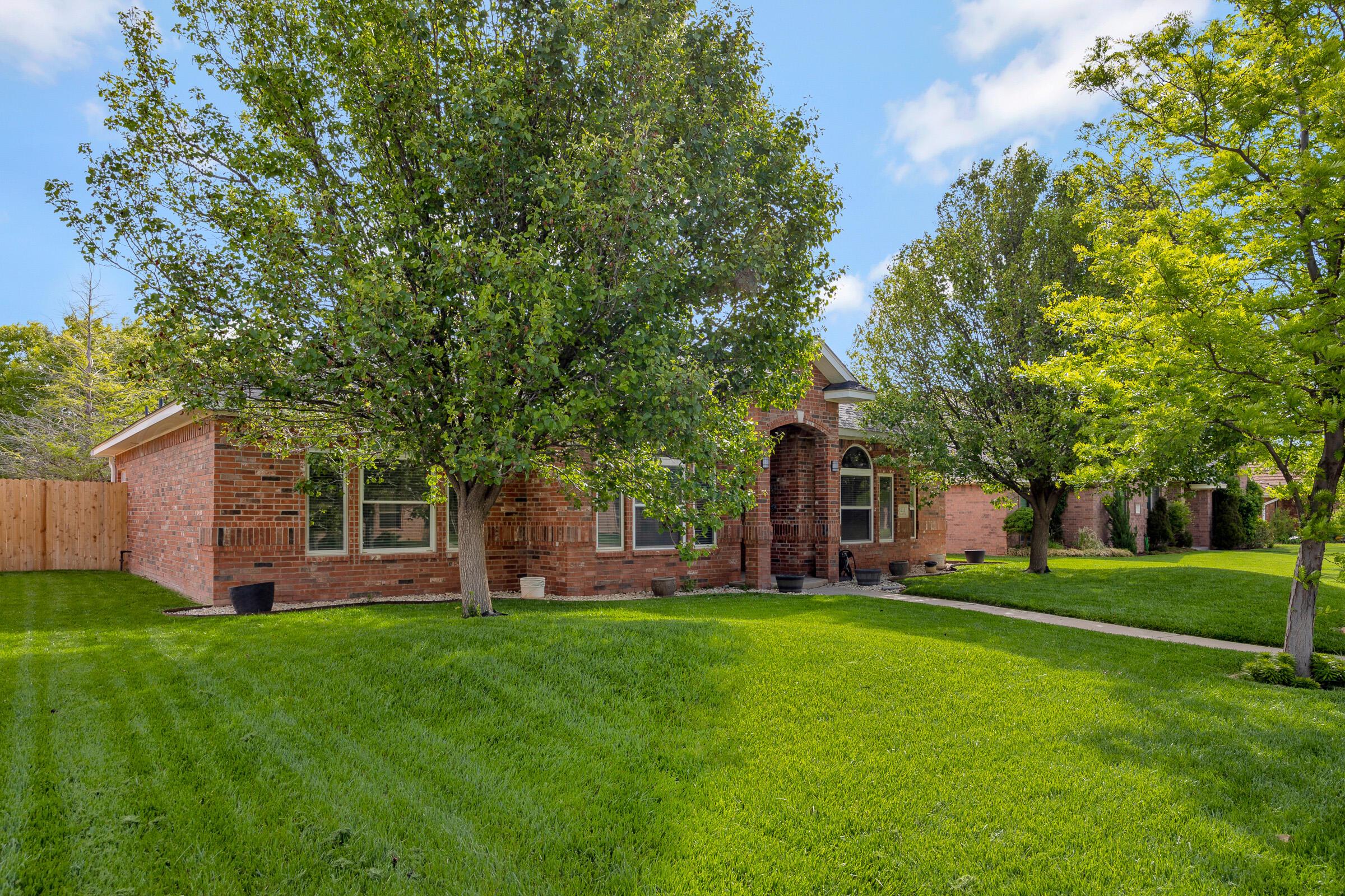 8211 Challenge Drive Amarillo, TX 79119 - Photo 31 of 31 a front view of house with yard and green space
