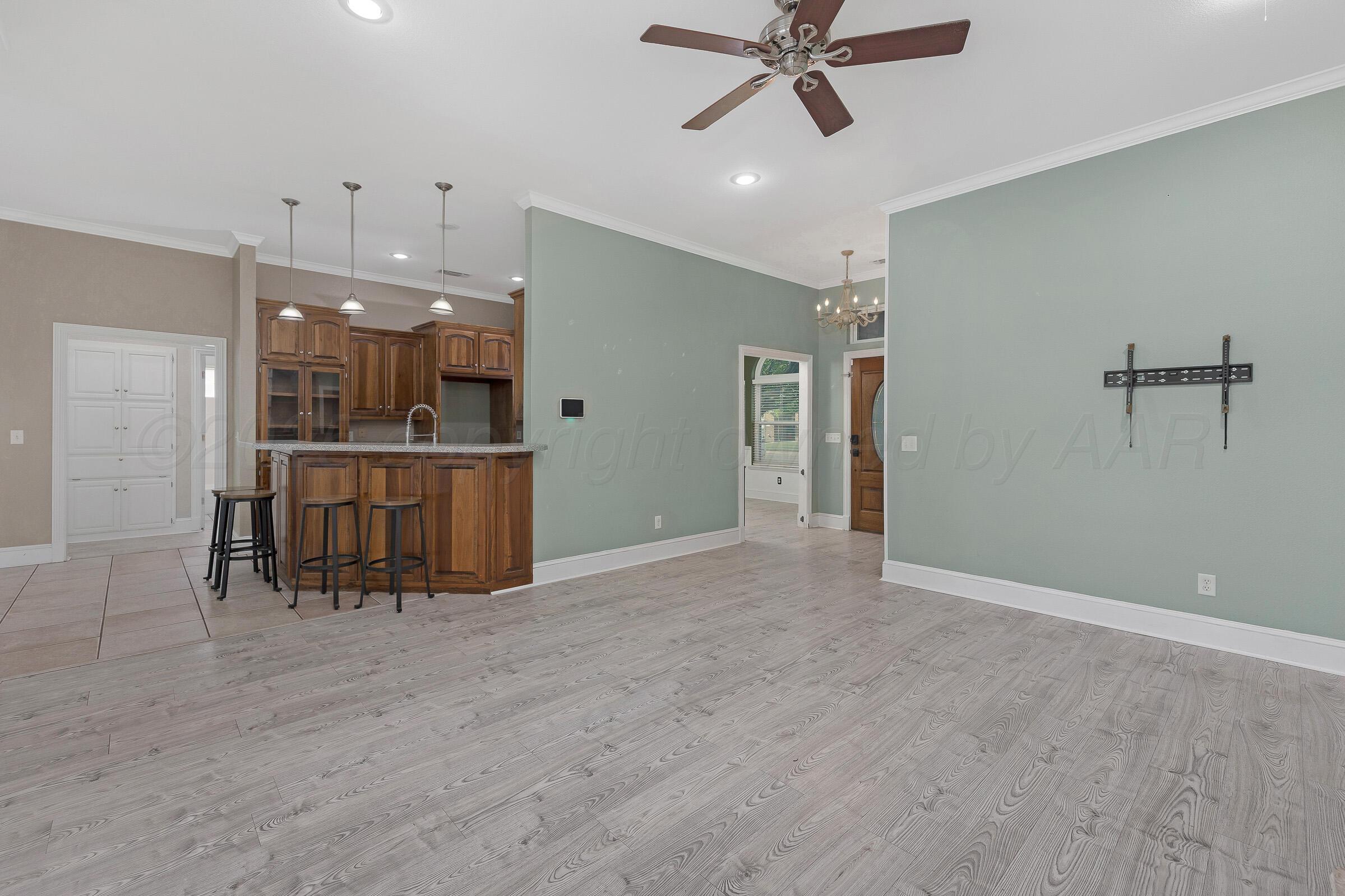8211 Challenge Drive Amarillo, TX 79119 - Photo 5 of 31 a view of a livingroom with a kitchen