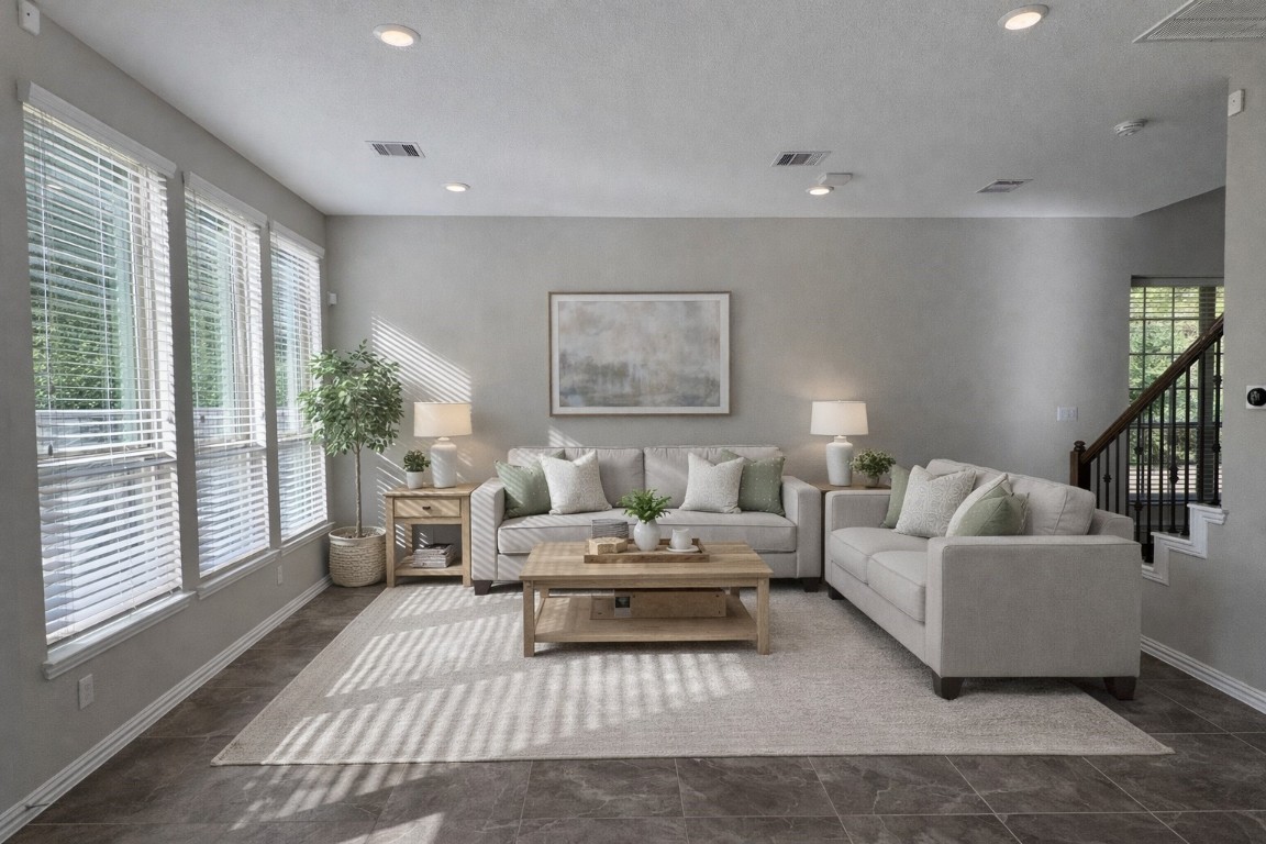a living room with furniture and a large window