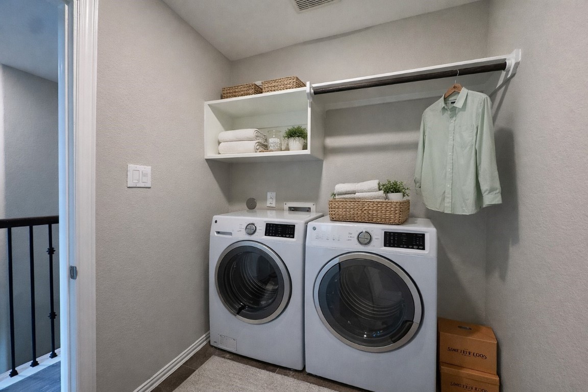 231 Moon Dance Court Conroe, TX 77304 - Photo 18 of 22 a utility room with dryer and washer