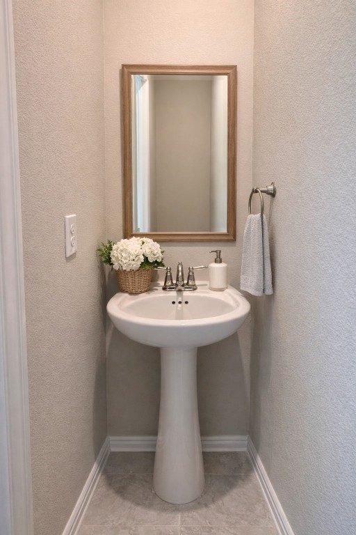 231 Moon Dance Court Conroe, TX 77304 - Photo 19 of 22 a bathroom with a sink a mirror and shower