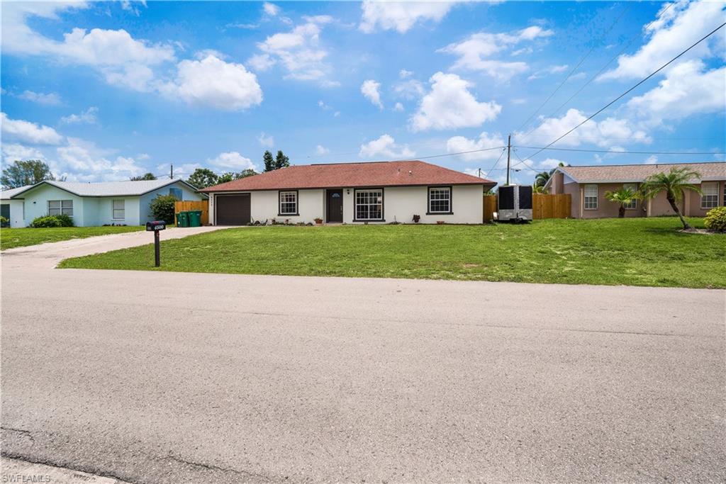 4500 30th Place Southwest Naples, FL 34116 - Photo 1 of 15 a view of a house next to a big yard