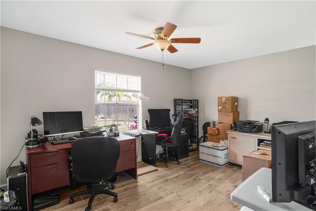 4500 30th Place Southwest Naples, FL 34116 - Photo 13 of 15 a view of a workspace with furniture and a window