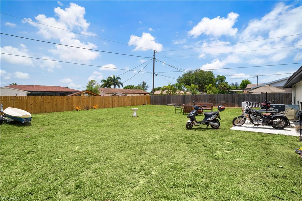 4500 30th Place Southwest Naples, FL 34116 - Photo 14 of 15 a view of yard with swimming pool and sitting area