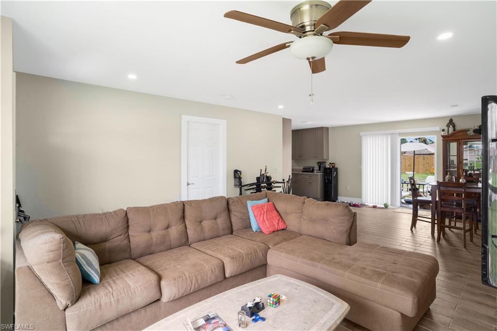4500 30th Place Southwest Naples, FL 34116 - Photo 4 of 15 a living room with furniture and kitchen view