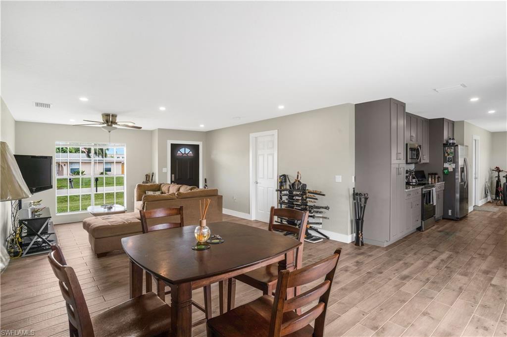 4500 30th Place Southwest Naples, FL 34116 - Photo 5 of 15 a view of a dining room with furniture window and outside view