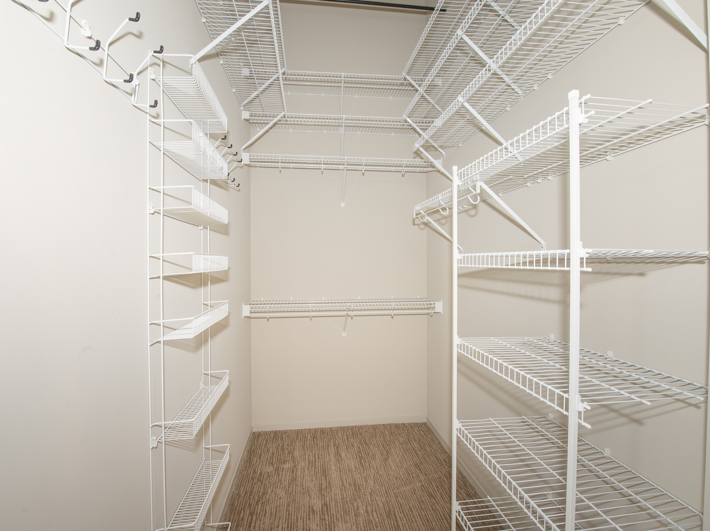 Undisclosed Address Chicago, IL 60607 - Photo 13 of 18 a view of an empty walk in closet
