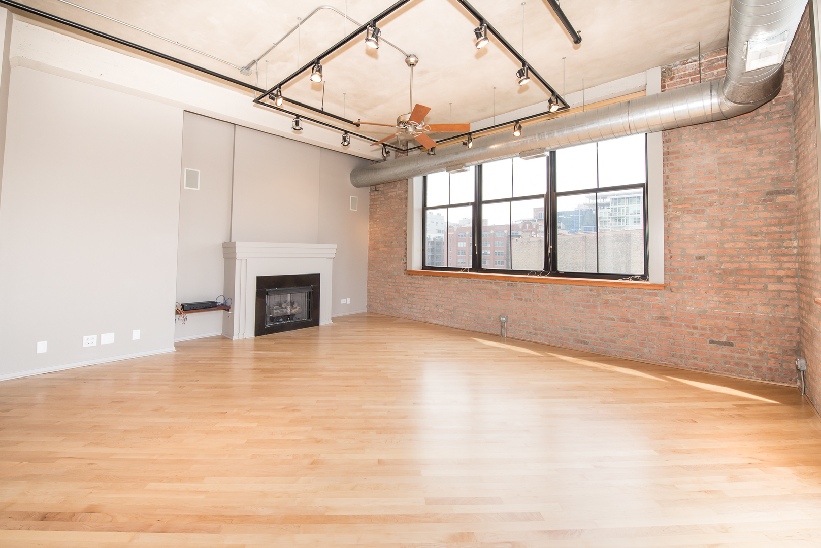 Undisclosed Address Chicago, IL 60607 - Photo 5 of 18 a view of empty room with a fireplace