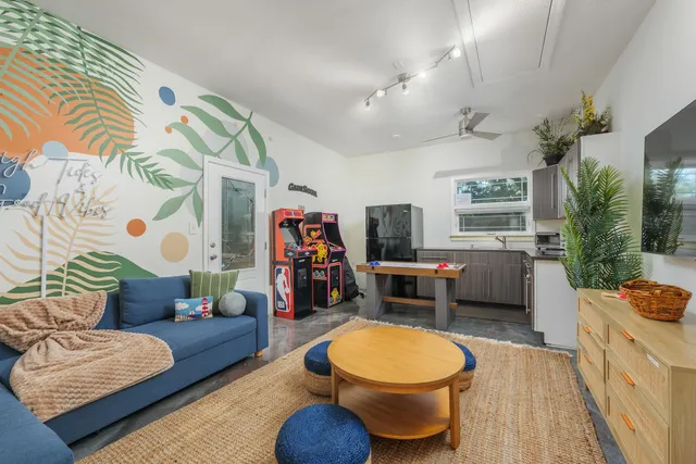 a view of a livingroom with furniture and a mirror