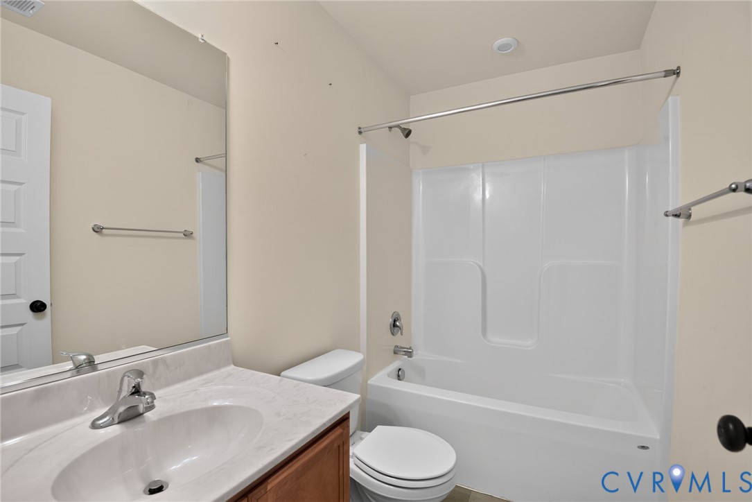 7825 Old Guild Road Richmond, VA 23237 - Photo 30 of 35 Bathroom featuring a white tub/shower combination