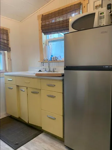 a bedroom with a bed and a television