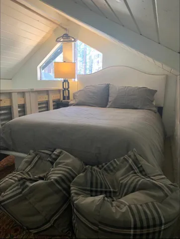 a kitchen with granite countertop cabinets stainless steel appliances and a window