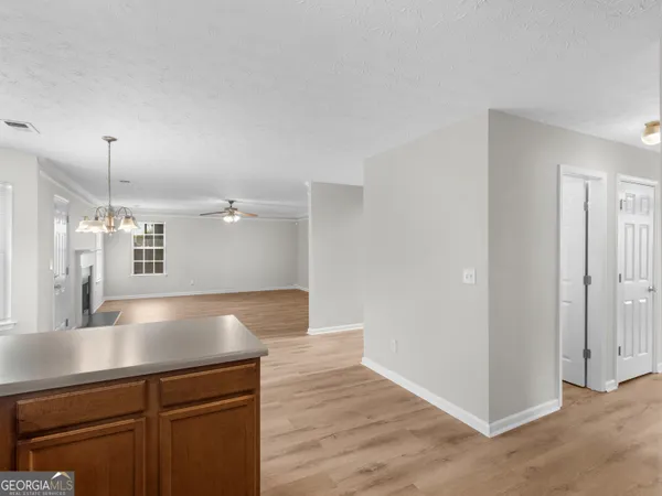 a view of a kitchen with a sink and dishwasher in kitchen