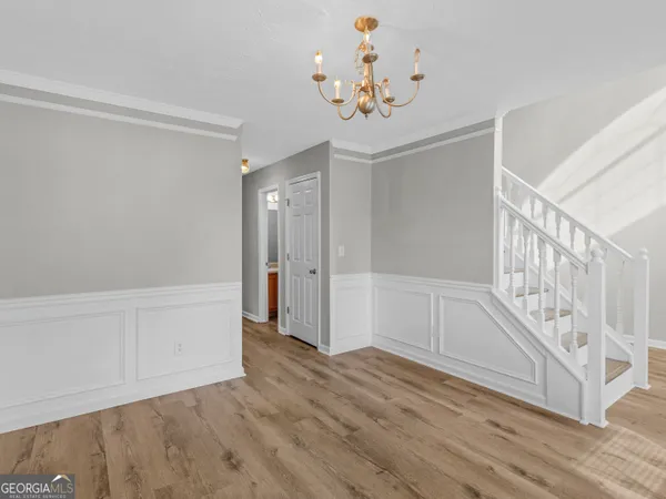a view of an entryway with wooden floor
