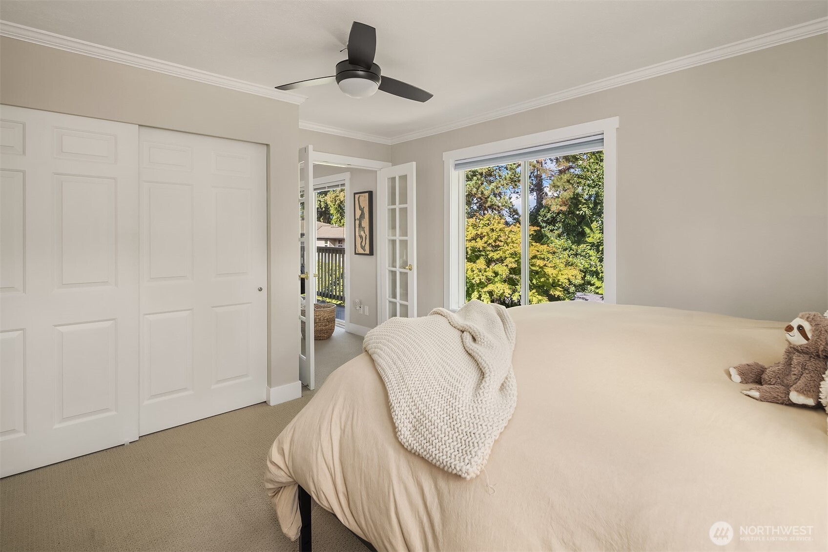5021 Ripley Lane North, Unit 211 Renton, WA 98056 - Photo 15 of 25 a bed sitting in a bedroom next to a window