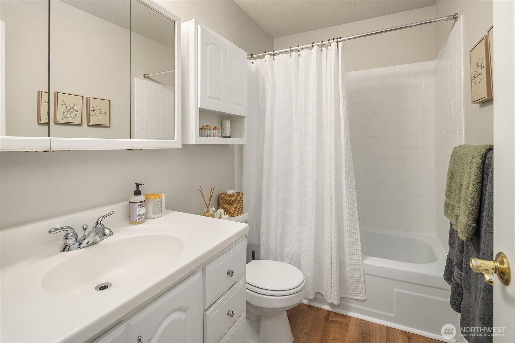 5021 Ripley Lane North, Unit 211 Renton, WA 98056 - Photo 17 of 25 a bathroom with a sink toilet and shower