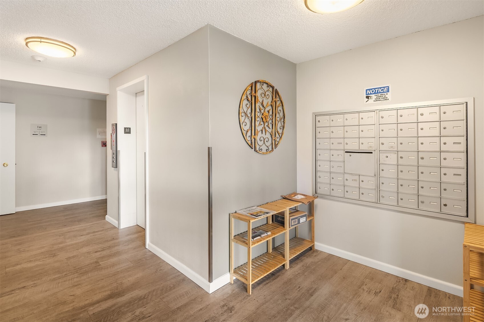 5021 Ripley Lane North, Unit 211 Renton, WA 98056 - Photo 19 of 25 a view of a hallway with elevator