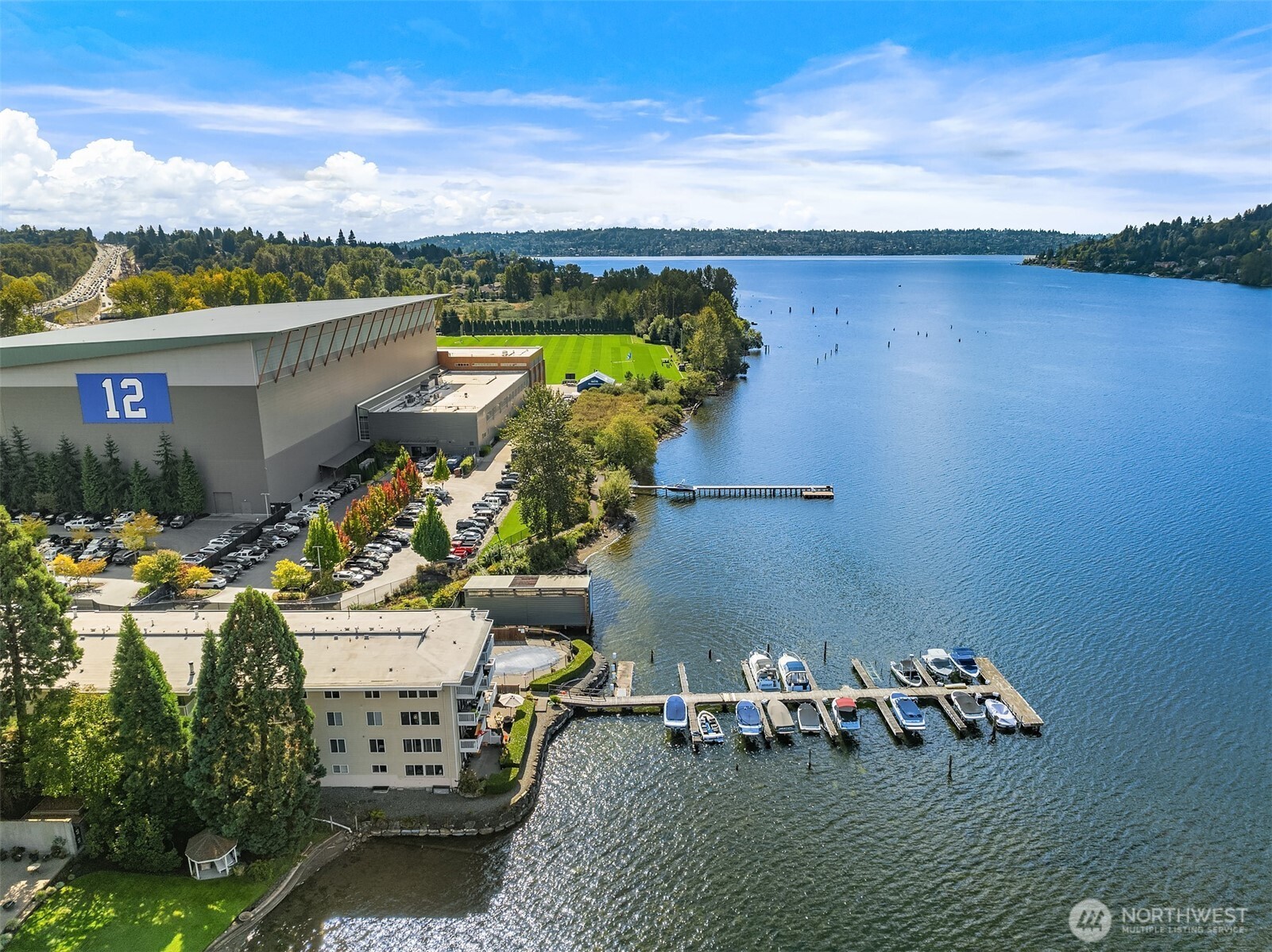 5021 Ripley Lane North, Unit 211 Renton, WA 98056 - Photo 20 of 25 a view of a lake with couches chairs