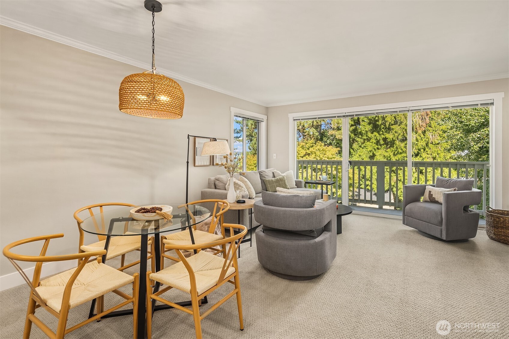 5021 Ripley Lane North, Unit 211 Renton, WA 98056 - Photo 7 of 25 a view of a dining room with furniture a chandelier and windows