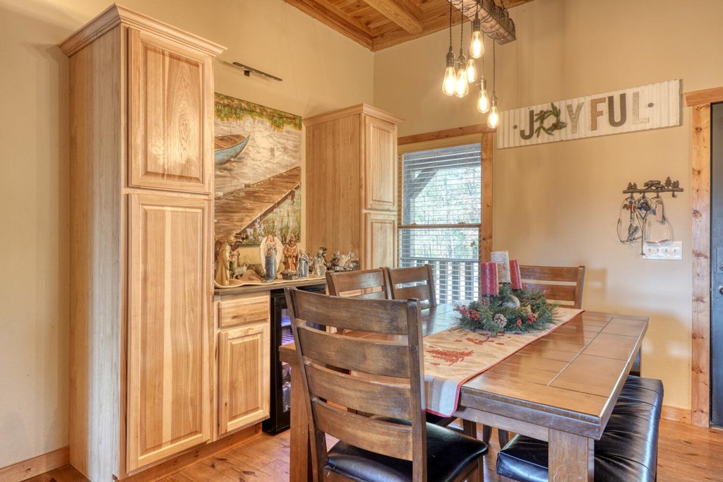 2567 Todd Shook Road Young Harris, GA 30582 - Photo 12 of 62 a view of a dining room with furniture window and wooden floor