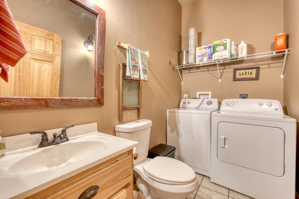 2567 Todd Shook Road Young Harris, GA 30582 - Photo 20 of 62 a bathroom with a sink toilet and mirror