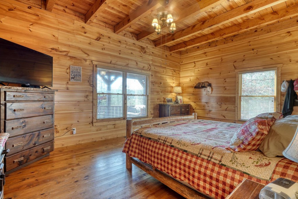 2567 Todd Shook Road Young Harris, GA 30582 - Photo 21 of 62 a spacious bedroom with a bed and a flat screen tv