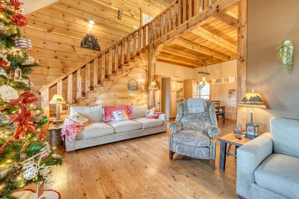 2567 Todd Shook Road Young Harris, GA 30582 - Photo 27 of 62 a living room with furniture and wooden floor