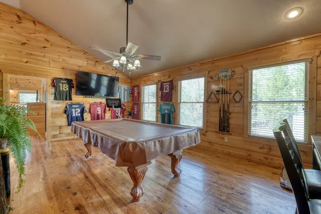a view of small pool with table and chairs