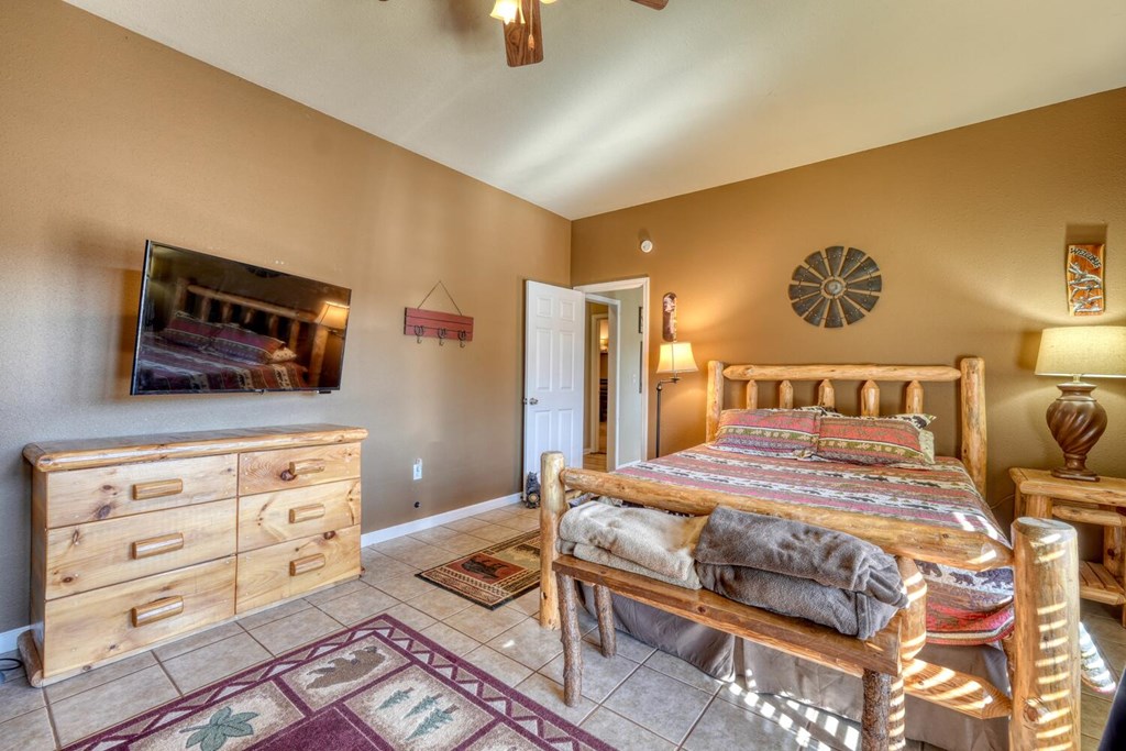 2567 Todd Shook Road Young Harris, GA 30582 - Photo 47 of 62 a bedroom with a bed and flat screen tv