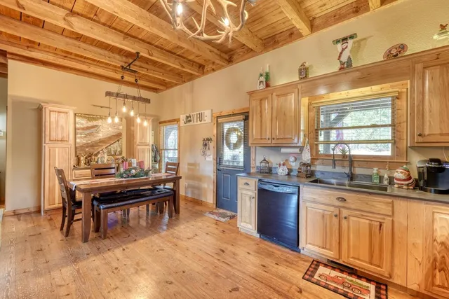 a kitchen with stainless steel appliances granite countertop a stove and cabinets