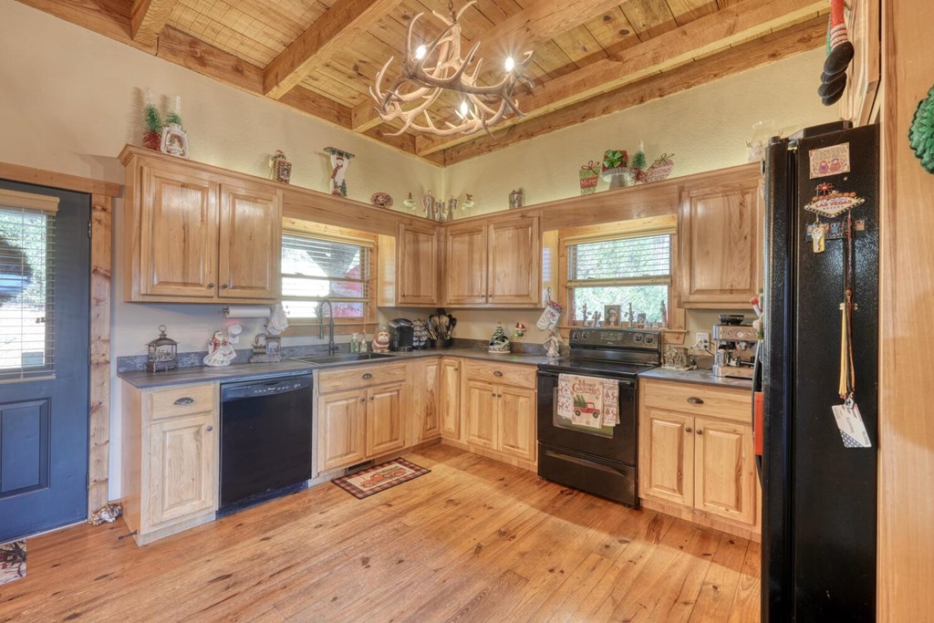 2567 Todd Shook Road Young Harris, GA 30582 - Photo 10 of 62 a kitchen with stainless steel appliances granite countertop a stove and cabinets